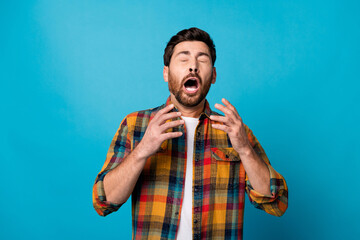 Photo portrait of nice young guy sneeze suffer infection cold dressed stylish checkered garment isolated on blue color background