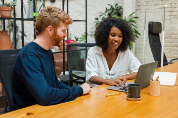 Business Colleagues Working Together In Modern Office