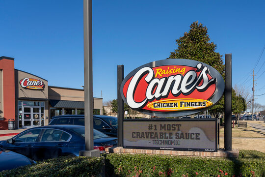 Pearland, Texas, USA - February 14, 2022: A Raising Cane's Chicken Fingers Restaurant in Pearland, Texas, USA. Raising Cane's Chicken Fingers is an American fast-food restaurant chain.