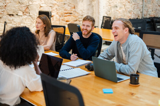 Positive Teamwork In Office Meeting