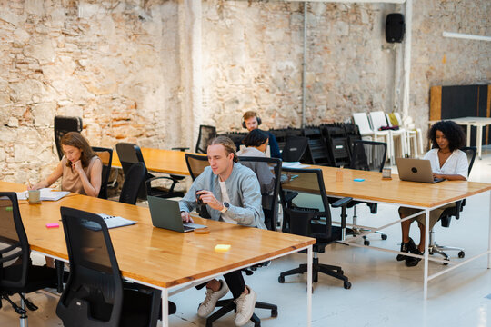 Group Of Diverse Coworkers In Modern Office