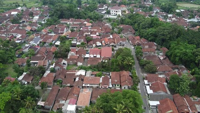 Aerial video of rural landscape with fields and villages in Indonesia