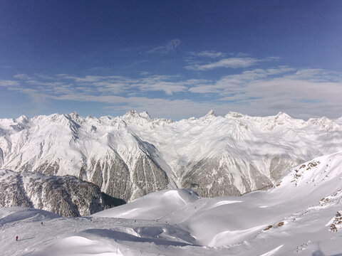 Mountain range from the top of Alps on a sunny day