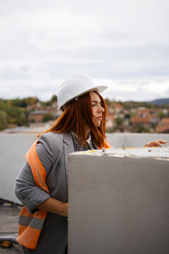 Woman engineer inspecting constraction site