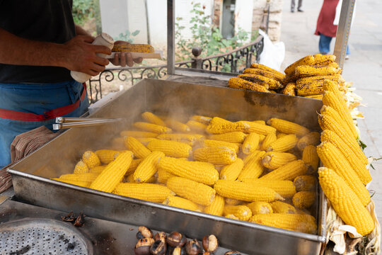 Anonymous Person Preparing Corn On The Street