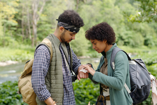 Woman Applying Patch On Boyfriends Hand