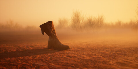 Lost cowboy boot in misty desolate desert landscape.