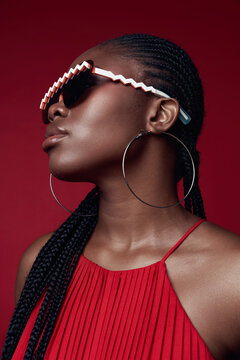    Portrait of black model wearing fashionable white glasses