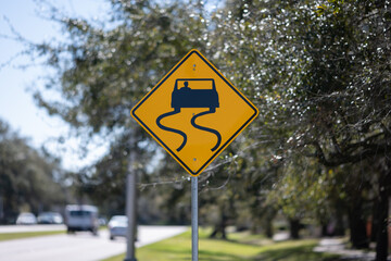 Road Sign slippery road warming close up