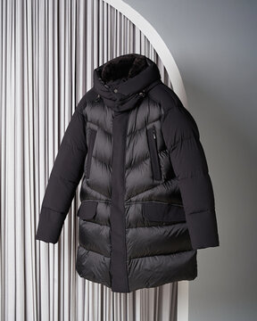 Stylish men's jacket levitating on grey background