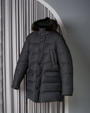 Stylish men's jacket levitating on grey background