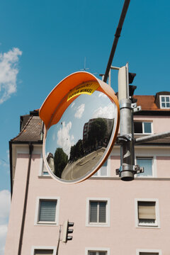 Sunny day urban snapshot with traffic mirror
