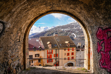 View of the old town of Briançon from a vaulted passage of the fortification walls built by Vauban in the French Alps - obrazy, fototapety, plakaty