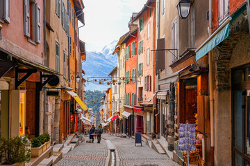 Grande Rue ("Main Street") shopping street flanked with colorful houses in the fortified city of Briançon built by Vauban in the French Alps