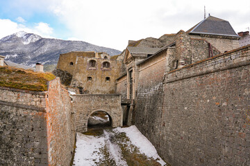 Stone bridge leading to the Gate of Pignerol in the fortified wall of Briançon, a city built by...