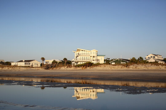 Beach House Refection In Ocean Water