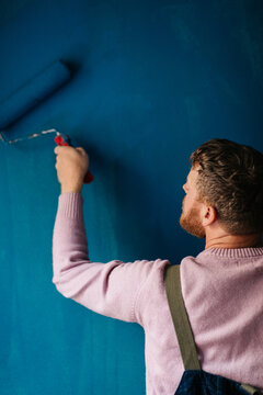 Man painting wall
