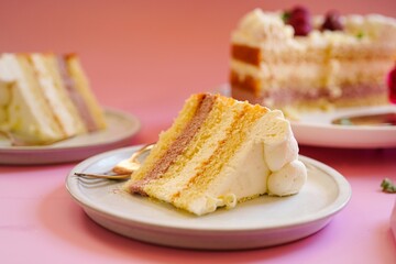 Slices of Lemon raspberry layer cake, selective focus