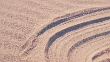 Wind Blowinng over Desert Beach Sand Surface Obliterating Blurring Foot Marks Track Making the...