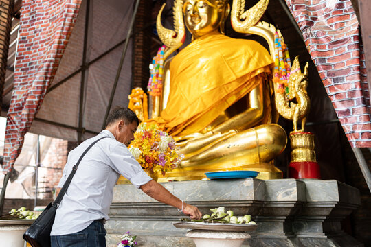 Thai man in buddhist temple.
