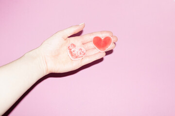 Cute,  sweet, red sugar heart candy representing and symbolizing love 