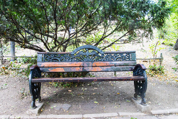 Lonely bench in Cismigiu Park, Bucharest, Romania