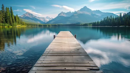  A serene lake with mountains in the background, featuring an empty wooden dock extending into the water. © Penatic Studio