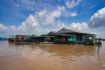 Fototapeta premium Floating homes on Tonle Sap Lake - Largest fresh water lake in Cambodia at Siem Reap, Cambodia, Asia