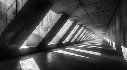 Foto op Canvas square tunnel with light coming from the top, captured in a black and white photographic style. The interior of an empty concrete room is visible through openings at both ends of each side of the wall © Stanislav