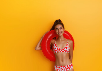 Beautiful cheerful brunette woman in a inflammable ring and smiling. Isolated background with empty space. Summer vacation and travel concept. - obrazy, fototapety, plakaty
