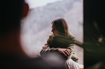A close-knit scene of friends engaging in a heartfelt conversation at home with a warm and...