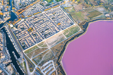 Aigues-Mortes and its pink lagoon from above in south France