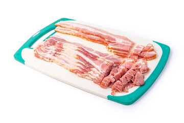 a half pound of sliced smoked bacon on a cutting board isolated on white