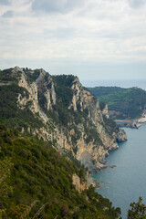 Fototapeta na wymiar Hiking trail by the Ligurian sea with cloudy sky to Portovenere, Italy