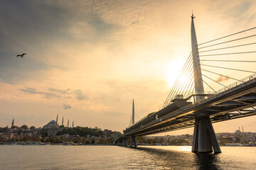 Sunset over the Golden Horn bridge in  Istanbul, Turkey