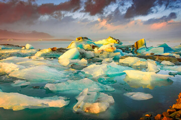 Amazing sunset over the icebergs of the Jokulsarlon Glacier Lagoon,  Iceland