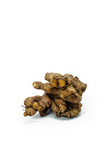 ginger slices on a white background. Ginger can be made as a spice in cooking or as a herbal medicine