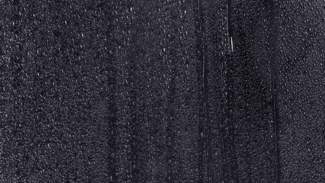 a water wet window weather transparent drip drops surface glass rain rainfall storm stormy falling condensation windshield backdrop light clear 4k motion raindrop night background