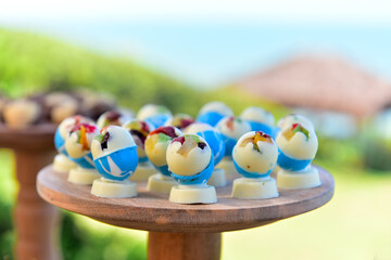 easter eggs on a wooden table, easter eggs on a wooden background, chocolate with candied fruits,...