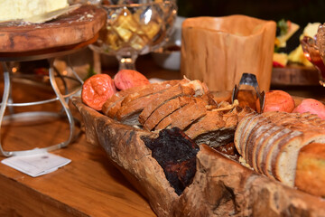 breads on a wooden table, breakfast buffet, bread tray, buffet with breads, bakery showcase, baker's day, thanksgiving day, thanksgiving, thanksgiving meal, haute cuisine	