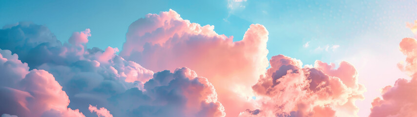 Soft, fluffy clouds blushing in pink and blue tones captured at the most magical time of day, the golden hour