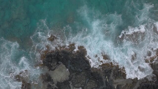 waves crashing on rocks