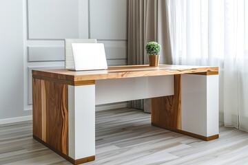 A wooden desk with a laptop and a potted plant on it