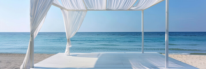 Peaceful beach scene, featuring a pavilion with breezy white curtains and panoramic ocean views