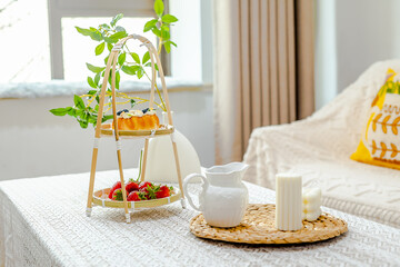 Afternoon tea with cream bread paired with strawberries and coffee