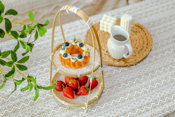 Afternoon tea with cream bread paired with strawberries and coffee