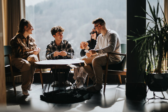Friends gathered around a table, sharing stories and laughs in a warm, sunlit space, embodying friendship and comfort.