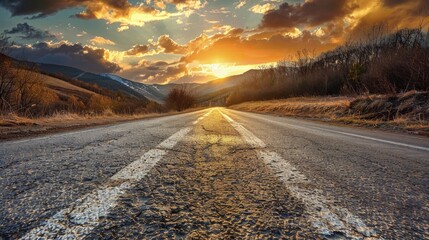 Open road at sunset leading through a scenic landscape, Concept of travel, journey, and the freedom of the open road
