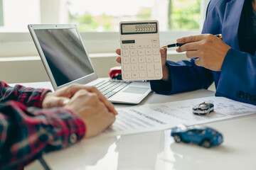 Car insurance or rental agreement or purchase or sale agreement with car keys on table Automotive...
