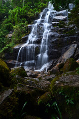 Véu da Noiva (Bridal Veil) waterfall surrounded by the lush subtropical montane rainforest of the lower sector of Itatiaia National Park, Itatiaia, Rio de Janeiro, Brazil.